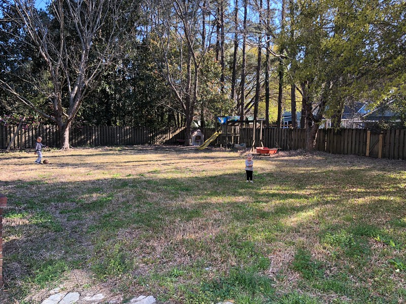 Family preparing for home renovation with packing boxes and planning at a rental house.
