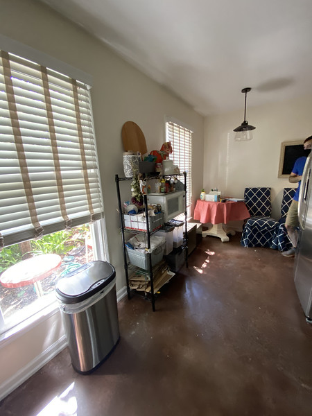 Before and after of a townhouse kitchen renovation showing modern cabinets, countertops, and fresh design updates.